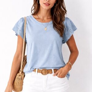 C&C California blue short sleeve top with beautiful eyelet lace flutter sleeves.